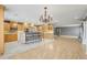 Kitchen with stainless steel appliances, breakfast bar, decorative chandelier, and lots of cabinet space at 4570 Chambliss Rd, Winter Haven, FL 33884