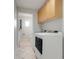 Laundry room with washer and dryer, with adjacent half bath at 4570 Chambliss Rd, Winter Haven, FL 33884
