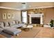 Cozy living room featuring a stone fireplace, hardwood floors, and comfortable seating at 4570 Chambliss Rd, Winter Haven, FL 33884