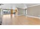 Spacious living room with fireplace, wood floors, open floor plan and ample natural light at 4570 Chambliss Rd, Winter Haven, FL 33884