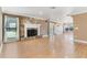 Spacious living room with hardwood floors, a stone fireplace, and an open layout at 4570 Chambliss Rd, Winter Haven, FL 33884