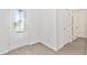 Bright entryway featuring a decorative glass front door and hard surface floors at 836 Poppy Ln, Dundee, FL 33838