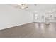 Spacious living room features hard surface flooring and lots of natural light at 836 Poppy Ln, Dundee, FL 33838