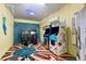 Vibrant arcade room featuring classic games and colorful decor, creating a fun entertainment space at 8944 Sugar Palm Rd, Kissimmee, FL 34747