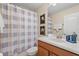 This bathroom offers a shower-tub combination, wood vanity, and neutral finishes at 8944 Sugar Palm Rd, Kissimmee, FL 34747