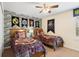 Themed bedroom with twin beds, stone accent wall and Harry Potter decor at 8944 Sugar Palm Rd, Kissimmee, FL 34747