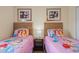 Themed bedroom featuring two beds, princess decor, and soft lighting, creating a magical space at 8944 Sugar Palm Rd, Kissimmee, FL 34747