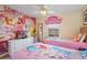 Charming bedroom with Disney Princess theme, playful decor, and comfortable twin beds at 8944 Sugar Palm Rd, Kissimmee, FL 34747