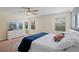 Spacious bedroom featuring a bed, ceiling fan, and neutral color palette at 8944 Sugar Palm Rd, Kissimmee, FL 34747