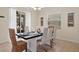 Inviting dining room with stylish furniture, perfect for Gathering meals and entertaining guests at 8944 Sugar Palm Rd, Kissimmee, FL 34747