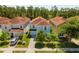 Charming two-story home with a well-manicured front yard and a blue exterior at 8944 Sugar Palm Rd, Kissimmee, FL 34747