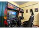 This game room features two vintage arcade games for endless entertainment and a nostalgic feel at 8944 Sugar Palm Rd, Kissimmee, FL 34747