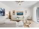 Bright living room features modern furnishings, neutral walls, and a ceiling fan at 8944 Sugar Palm Rd, Kissimmee, FL 34747