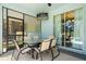 This screened patio has an outdoor dining set and wall-mounted TV, perfect for relaxing and entertaining at 8944 Sugar Palm Rd, Kissimmee, FL 34747