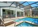 Beautiful screened-in pool and spa area, perfect for relaxing and entertaining outdoors at 8944 Sugar Palm Rd, Kissimmee, FL 34747