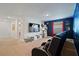 Home theater room features a large screen TV, themed decor, and comfortable seating at 8944 Sugar Palm Rd, Kissimmee, FL 34747