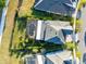Aerial view highlights the fenced backyard and landscaping surrounding the home at 9254 Reymont St, Orlando, FL 32827