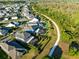 Aerial shot displays the home's proximity to a walking path and lush greenery at 9254 Reymont St, Orlando, FL 32827