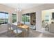 Light-filled dining area with sliding glass doors to the patio, adjacent to the living area at 9254 Reymont St, Orlando, FL 32827