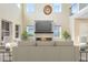 Bright living room with high ceilings, a modern fireplace, and large windows for ample natural light at 9254 Reymont St, Orlando, FL 32827