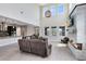 Spacious living room with high ceilings, modern fireplace, and large windows for natural light at 9254 Reymont St, Orlando, FL 32827