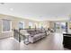Relaxing loft featuring neutral paint, railing, a TV and comfortable seating at 9254 Reymont St, Orlando, FL 32827
