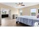Spacious main bedroom with wood-look floors and an en suite bathroom at 9254 Reymont St, Orlando, FL 32827