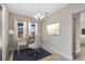 Bright office space with a large window, desk and chair, enhanced by a stylish light fixture at 9254 Reymont St, Orlando, FL 32827