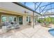 Backyard patio with outdoor furniture and a private pool at 9254 Reymont St, Orlando, FL 32827
