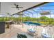 Pool with patio furniture, bar and an outdoor kitchen at 9254 Reymont St, Orlando, FL 32827