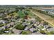 Aerial view of home located near a golf course, highway, and community lake at 9826 Heron Pointe Dr, Orlando, FL 32832