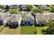 Aerial view of backyard featuring lush lawn, patio and close proximity to neighbors at 9826 Heron Pointe Dr, Orlando, FL 32832
