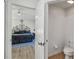 Ensuite bath and bedroom separated by a door and hallway at 9826 Heron Pointe Dr, Orlando, FL 32832