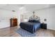 Spacious bedroom featuring wood-look floors, a ceiling fan, and neutral walls at 9826 Heron Pointe Dr, Orlando, FL 32832