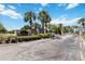 Gated community entrance featuring well-maintained landscaping and signage at 9826 Heron Pointe Dr, Orlando, FL 32832