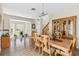 Elegant dining room with hardwood floors, natural lighting, and a wooden dining table at 9826 Heron Pointe Dr, Orlando, FL 32832