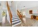 Open-concept room with dining area, staircase, and hardwood floors at 9826 Heron Pointe Dr, Orlando, FL 32832
