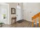 Bright entryway featuring hardwood floors, a high ceiling, and a staircase at 9826 Heron Pointe Dr, Orlando, FL 32832
