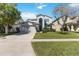 Charming two-story home featuring a well-manicured lawn and an attached two-car garage at 9826 Heron Pointe Dr, Orlando, FL 32832