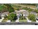 Aerial view of a two-story home with a well-manicured lawn adjacent to the golf course at 9826 Heron Pointe Dr, Orlando, FL 32832