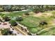 Aerial shot of the golf course, putting green, and driving range in a neighborhood setting at 9826 Heron Pointe Dr, Orlando, FL 32832