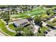 Aerial shot of clubhouse and golf course, showcasing a serene and green landscape at 9826 Heron Pointe Dr, Orlando, FL 32832