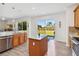 Open kitchen with stainless steel appliances, granite countertops, and center island at 9826 Heron Pointe Dr, Orlando, FL 32832