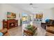 Open concept living space featuring fireplace and sliding doors to patio at 9826 Heron Pointe Dr, Orlando, FL 32832