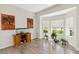 Bright living room area featuring hardwood floors, natural light, and neutral-tone walls at 9826 Heron Pointe Dr, Orlando, FL 32832