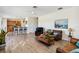 Open concept living space with wood-look floors and a view of the kitchen at 9826 Heron Pointe Dr, Orlando, FL 32832