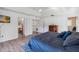 Main bedroom featuring hard surface floors, ceiling fan and ensuite bathroom at 9826 Heron Pointe Dr, Orlando, FL 32832
