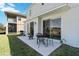 Open patio with outdoor seating and view of the spacious backyard at 9826 Heron Pointe Dr, Orlando, FL 32832