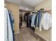 Walk-in closet with organization and shelving for optimal storage at 9826 Heron Pointe Dr, Orlando, FL 32832