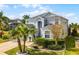 Charming two-story home with landscaped yard, attached garage and arched entryway, perfect for Florida living at 119 Horton Park Dr, Davenport, FL 33897